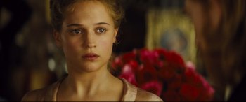 Movie still from “Anna Karenina” (2012), directed by Joe Wright – A person wearing a pink shirt; Close Up shot, Over the shoulder angle