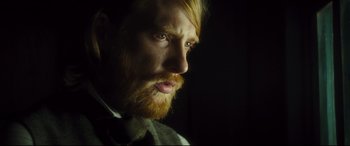 Movie still from “Anna Karenina” (2012), directed by Joe Wright – A person with a beard; Close Up shot, Over the shoulder angle