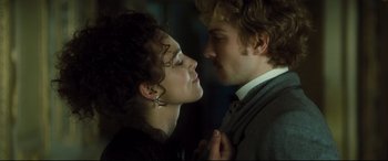 Movie still from “Anna Karenina” (2012), directed by Joe Wright – A man and a woman standing next to each other; Close Up shot, Low angle