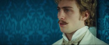 Movie still from “Anna Karenina” (2012), directed by Joe Wright – A person wearing a bow tie; Close Up shot, Low angle