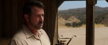 Movie still from “Annabelle: Creation” (2017), directed by David F. Sandberg – A person standing in front of a window; Close Up shot, Over the shoulder angle