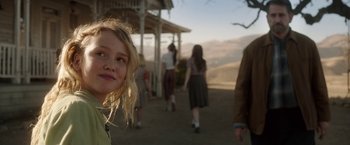 Movie still from “Annabelle: Creation” (2017), directed by David F. Sandberg – A woman standing in front of a group of people on a hill; Close Up shot, Over the shoulder angle