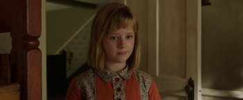 Movie still from “Annabelle: Creation” (2017), directed by David F. Sandberg – A young girl with long blonde hair wearing a red shirt; Close Up shot, Over the shoulder angle