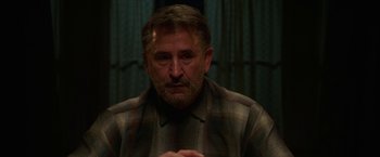 Movie still from “Annabelle: Creation” (2017), directed by David F. Sandberg – A person wearing a plaid shirt; Close Up shot, Over the shoulder angle