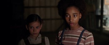 Movie still from “Annabelle: Creation” (2017), directed by David F. Sandberg – Two young children standing next to each other in a dark room; Close Up shot, High angle