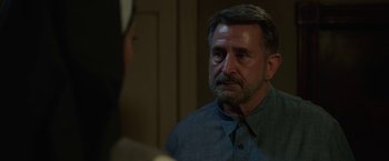 Movie still from “Annabelle: Creation” (2017), directed by David F. Sandberg – A person wearing a blue shirt; Close Up shot, Over the shoulder angle