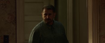 Movie still from “Annabelle: Creation” (2017), directed by David F. Sandberg – A person standing in a room; Medium shot, Over the shoulder angle