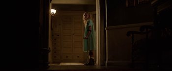 Movie still from “Annabelle: Creation” (2017), directed by David F. Sandberg – A woman holding a cane standing in a doorway; Wide shot, Low angle