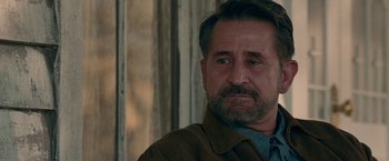 Movie still from “Annabelle: Creation” (2017), directed by David F. Sandberg – A person with a beard; Close Up shot, Over the shoulder angle