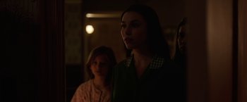 Movie still from “Annabelle: Creation” (2017), directed by David F. Sandberg – Two young women standing next to each other in a dark room; Medium shot, Over the shoulder angle