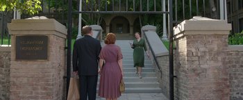Movie still from “Annabelle: Creation” (2017), directed by David F. Sandberg – A woman is walking down the steps of a building; Wide shot, Over the shoulder angle