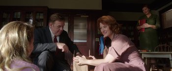 Movie still from “Annabelle: Creation” (2017), directed by David F. Sandberg – A man and a woman sitting next to each other; Medium shot, Low angle