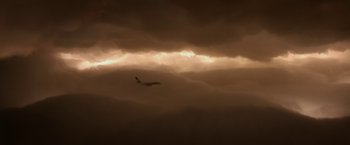 Movie still from “Anomalisa” (2015), directed by Duke Johnson – An airplane is flying through a cloudy sky; Extreme Wide shot, Low angle