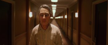 Movie still from “Anomalisa” (2015), directed by Duke Johnson – A man with glasses is standing in a hallway; Close Up shot, High angle