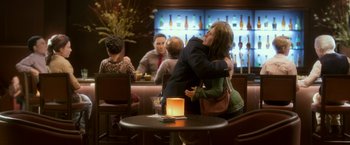 Movie still from “Anomalisa” (2015), directed by Duke Johnson – A man and a woman hugging in a restaurant; Medium shot, Over the shoulder angle