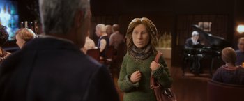 Movie still from “Anomalisa” (2015), directed by Duke Johnson – A woman in a green sweater is talking to an older man in a restaurant; Close Up shot, Over the shoulder angle