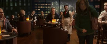 Movie still from “Anomalisa” (2015), directed by Duke Johnson – A man and a woman are sitting at a table in a restaurant; Medium shot, High angle