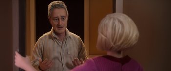 Movie still from “Anomalisa” (2015), directed by Duke Johnson – A man talking to a woman in a mirror; Medium shot, Over the shoulder angle