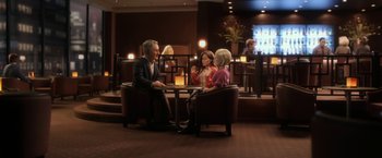 Movie still from “Anomalisa” (2015), directed by Duke Johnson – A group of people sitting at a table in a room; Wide shot, High angle