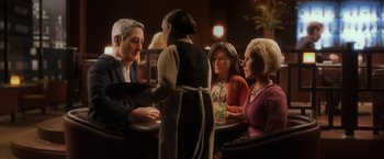 Movie still from “Anomalisa” (2015), directed by Duke Johnson – A group of people sitting around a table; Medium shot, High angle