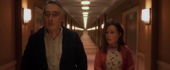 Movie still from “Anomalisa” (2015), directed by Duke Johnson – A man and a young girl walking down a hallway; Close Up shot, High angle