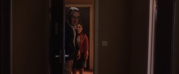 Movie still from “Anomalisa” (2015), directed by Duke Johnson – A man and a woman standing in front of an open door; Medium shot, Over the shoulder angle