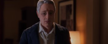 Movie still from “Anomalisa” (2015), directed by Duke Johnson – A person wearing a suit and tie; Close Up shot, High angle