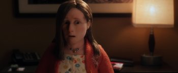 Movie still from “Anomalisa” (2015), directed by Duke Johnson – A doll wearing a red sweater; Close Up shot, Over the shoulder angle