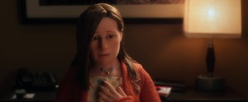 Movie still from “Anomalisa” (2015), directed by Duke Johnson – A woman holding a cup in her hands; Close Up shot, Over the shoulder angle