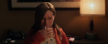 Movie still from “Anomalisa” (2015), directed by Duke Johnson – A young girl drinking a glass of water; Close Up shot, Over the shoulder angle