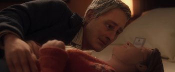 Movie still from “Anomalisa” (2015), directed by Duke Johnson – A man looking down at a baby; Close Up shot, High angle