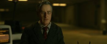 Movie still from “Anomalisa” (2015), directed by Duke Johnson – A toy doll of a man in a suit and tie; Close Up shot, High angle