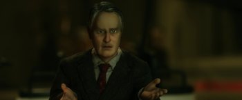 Movie still from “Anomalisa” (2015), directed by Duke Johnson – A man in a suit and red neck tie; Close Up shot, Over the shoulder angle