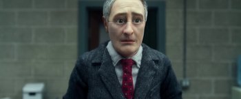 Movie still from “Anomalisa” (2015), directed by Duke Johnson – A man wearing a suit and tie with glasses; Close Up shot, Low angle