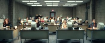 Movie still from “Anomalisa” (2015), directed by Duke Johnson – A group of people sitting at desks in a room; Extreme Wide shot, High angle
