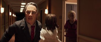 Movie still from “Anomalisa” (2015), directed by Duke Johnson – A man and a woman standing in front of a mirror with a little girl; Close Up shot, Over the shoulder angle
