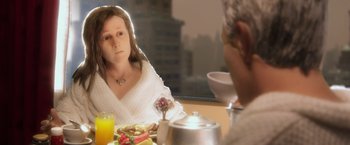 Movie still from “Anomalisa” (2015), directed by Duke Johnson – A woman sitting at a table with a bowl of food; Close Up shot, Over the shoulder angle