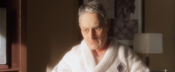 Movie still from “Anomalisa” (2015), directed by Duke Johnson – An older man in a white bathrobe looks angry; Close Up shot, High angle