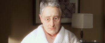 Movie still from “Anomalisa” (2015), directed by Duke Johnson – An old man wearing a white bathrobe and glasses; Extreme Close Up shot, High angle