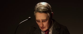 Movie still from “Anomalisa” (2015), directed by Duke Johnson – A wax figure of a man in a suit and tie; Extreme Close Up shot, High angle