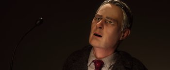 Movie still from “Anomalisa” (2015), directed by Duke Johnson – A wax figure of a man in a suit and tie; Close Up shot, Low angle