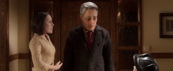 Movie still from “Anomalisa” (2015), directed by Duke Johnson – A man and woman standing next to each other in front of a wooden door; Close Up shot, Over the shoulder angle