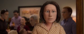 Movie still from “Anomalisa” (2015), directed by Duke Johnson – A doll of a woman in a polka dot shirt; Close Up shot, Over the shoulder angle