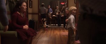 Movie still from “Anomalisa” (2015), directed by Duke Johnson – A group of people standing in a room; Wide shot, High angle
