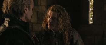 Movie still from “Anonymous” (2011), directed by Roland Emmerich – A person with long curly hair; Close Up shot, Over the shoulder angle