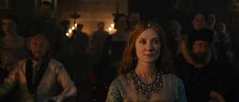 Movie still from “Anonymous” (2011), directed by Roland Emmerich – A woman with red hair wearing a necklace; Close Up shot, Over the shoulder angle