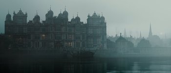 Movie still from “Anonymous” (2011), directed by Roland Emmerich – A boat is in front of a large building in the fog; Extreme Wide shot, Low angle