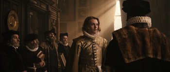 Movie still from “Anonymous” (2011), directed by Roland Emmerich – A group of men standing next to each other in front of a window; Medium shot, Over the shoulder angle