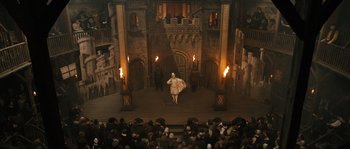 Movie still from “Anonymous” (2011), directed by Roland Emmerich – An audience watching a performance of shakespeare's " the taming of the shrew "; Extreme Wide shot, High angle