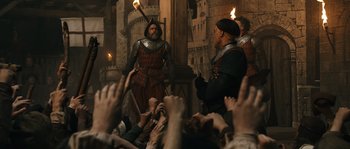 Movie still from “Anonymous” (2011), directed by Roland Emmerich – A group of people standing in front of a building; Wide shot, Over the shoulder angle